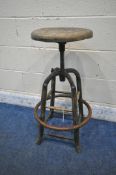 AN INDUSTRIAL ADJUSTABLE MACHINISTS STOOL, with wooden frame and seat, diameter 43cm x maximum