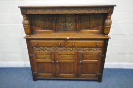 A 20TH CENTURY OAK COURT CUPBOARD, with repeating scrolled pattern, bulbous turned supports, two