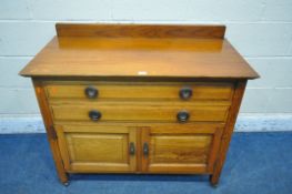 AN EARLY 20TH CENTURY OAK CABINET, with a raised back, two drawers and two cupboard doors, width