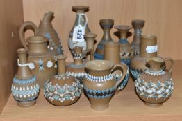 A GROUP OF DOULTON LAMBETH SILICON WARE VASES AND JUGS, fourteen pieces with applied floral, foliate