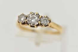 A THREE STONE DIAMOND RING, three round brilliant cut diamonds, in a white metal illusion setting