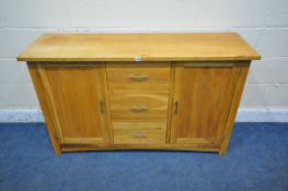 A MODERN SOLID OAK SIDEBOARD, with double cupboard doors, flanking three drawers, width 135cm x