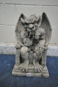 A MODERN COMPOSITE GROTESQUE FIGURE, seated on a throne, width 30cm x depth 20cm x height 48cm (