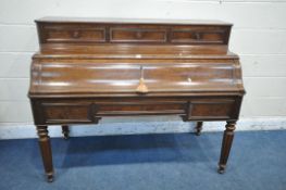 A VICTORIAN MAHOGANY DESK, the removable top section with three fall front drawers, above a
