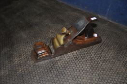 A VINTAGE STEEL FOOTED SMOOTHING PLANE with wooden body with J.Davidson stamped in two places, a