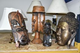 A GROUP OF FOUR TABLE LAMPS AND CARVED WOOD FIGURES, comprising a cream onyx table lamp, a