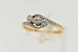 A THREE STONE DIAMOND RING, three single cut diamonds, illusion set in white metal, leading onto