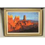 ROLF HARRIS (1930-2023) 'MONUMENT VALLEY', a signed limited edition print on canvas, depicting an