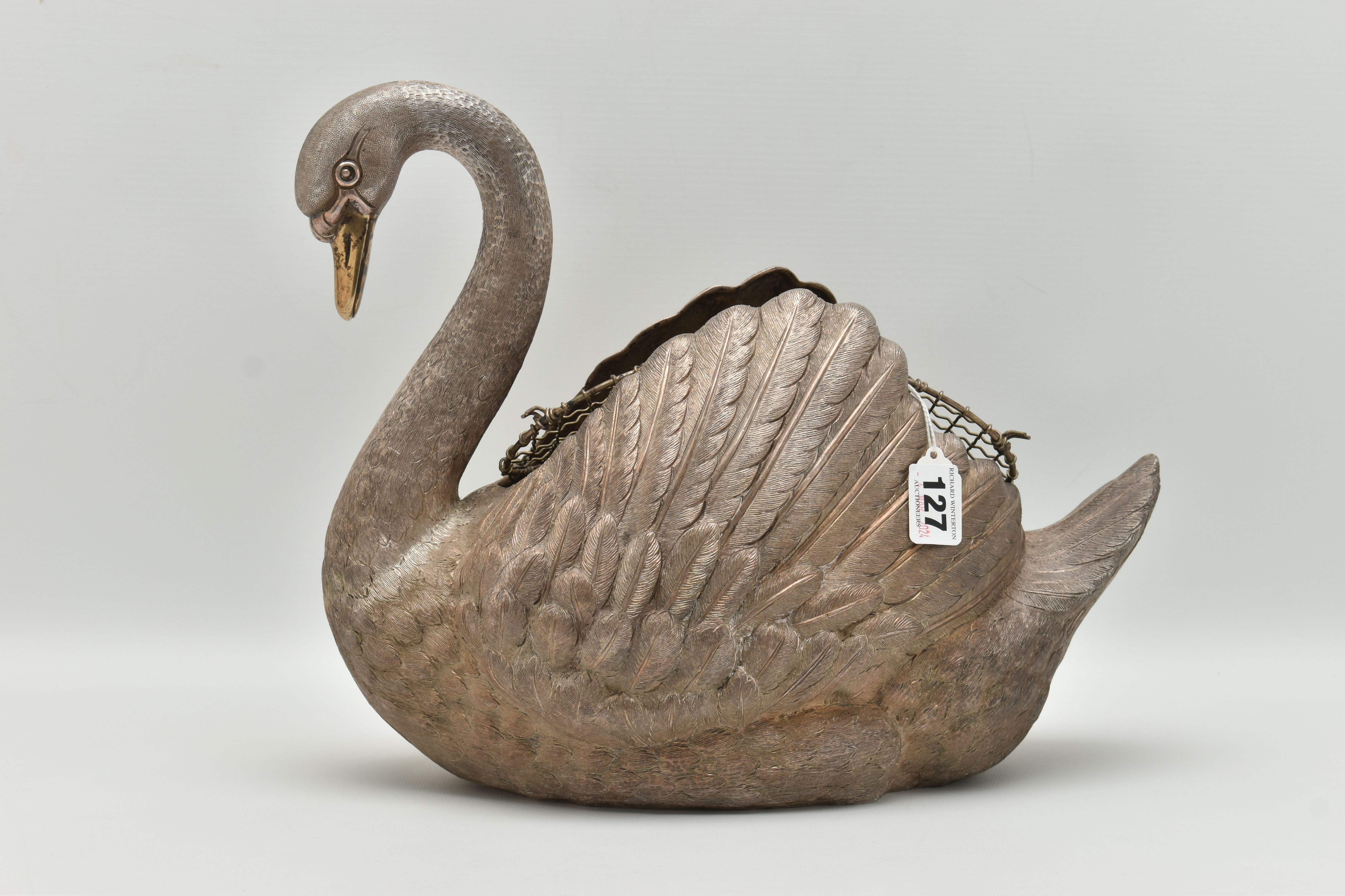 AN ELIZABETH II SILVER FLORAL CENTREPIECE, realistically textured swan with a gold plated beak, open