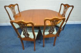 A 20TH CENTURY EXTENDING DINING TABLE, with a single fold out leaf, on a single pedestal with four