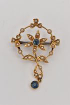 AN EDWARDIAN SPLIT PEARL AND SAPPHIRE PENDANT, of circular outline with a central flower set with