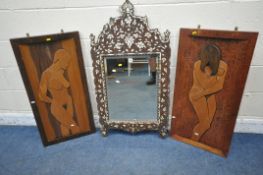 A FLAMBOYANT INDIAN WALL MIRROR, with mother of pearl inlay and a bevelled mirror plate, 60cm x