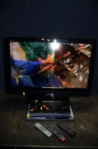 A TOSHIBA REGZA 32AV633D 32in TV with remote, a Goodman's Freeview box with remote, a Logik DVD