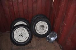 A SET OF FOUR 14in STEEL RIMS from Triumph Spitfire all with tyres from Zimbabwe and four chromed