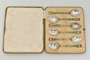 A CASED SET OF SIX ENAMEL SILVER TEASPOONS, each decorated with a green enamel floral stem and