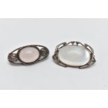 TWO BROOCHES, the first of an oval form, set with an oval cut moonstone cabochon, open work