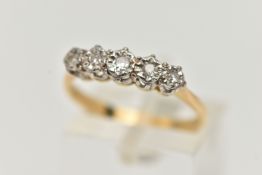 A FIVE STONE DIAMOND RING, five single cut diamonds in a white metal illusion setting leading on