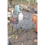 A MODERN CAST ALUMINIUM ROUND GARDEN TABLE AND TWO CHAIRS with pierced detail to seat and 60cm