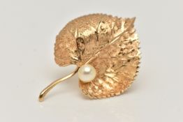 A 'CHRISTIAN DIOR' LEAF BROOCH, set with an imitation pearl, fitted with a brooch pin and saftey