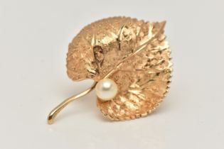 A 'CHRISTIAN DIOR' LEAF BROOCH, set with an imitation pearl, fitted with a brooch pin and saftey