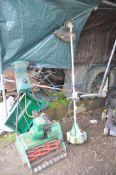 A VINTAGE SUFFOLK PUNCH 43s PETROL LAWN MOWER with grass box and a Florabest FBS43A1 petrol strimmer