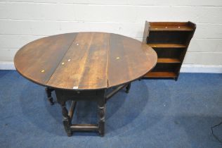 A GEORGIAN OAK GATE LEG TABLE, with a single drawer to one end, raised on block and turned supports,