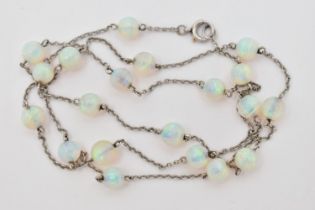 A WHITE METAL OPAL BEAD NECKLACE, twenty opal beads each interspaced and fitted to a fine white