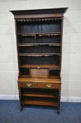 A LATE 19TH / EARLY 20TH CENTURY WALNUT BOOKCASE / WRITING DESK, three adjustable shelves, over a