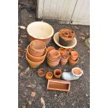 A COLLECTION OF TWO GLAZED PLANTERS AND A QUANTITY OF TERRACOTTA POTS of various sizes including a