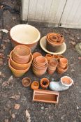 A COLLECTION OF TWO GLAZED PLANTERS AND A QUANTITY OF TERRACOTTA POTS of various sizes including a
