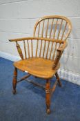 A 19TH CENTURY ELM WINDSOR ARMCHAIR, with turned supports, legs and stretchers (condition report: