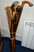 A GROUP OF THIRTEEN WALKING STICKS, comprising a novelty hand painted stick with a carved 'Salmon'