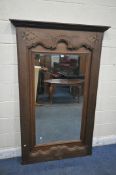 A LARGE 19TH CENTURY FRENCH WALNUT MIRROR, with parquetry inlay and scrolled carved detail, width