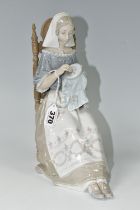 A LLADRO FIGURE INSULAR EMBROIDERESS, NO. 4865, sculpted by Salvador Furio, issued 1974-1994,