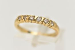 AN 18CT GOLD DIAMOND BAND RING, six round brilliant cut diamonds, prong set in yellow gold, hallmark