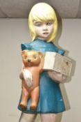 A VINTAGE FIBREGLASS DISABILITY CHARITY COLLECTION BOX IN THE FORM OF A GIRL HOLDING A TEDDY WITH