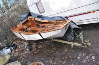 A VINTAGE WOODEN SAILING BOAT 11 feet long 4ft6in wide with mast (no sail) two oars and