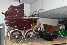 A LARGE QUANTITY OF EARLY TO MID CENTURY DOLL'S PRAMS, COTS AND ACCESSORIES, comprising a burgundy
