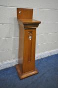 A 20TH CENTURY OAK CHURCH COLLECTION BOX, with a raised back, small money slot, raised on a