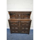 A 20TH CENTURY OAK COURT CUPBOARD, with repeating arched details, two doors, above two drawers and