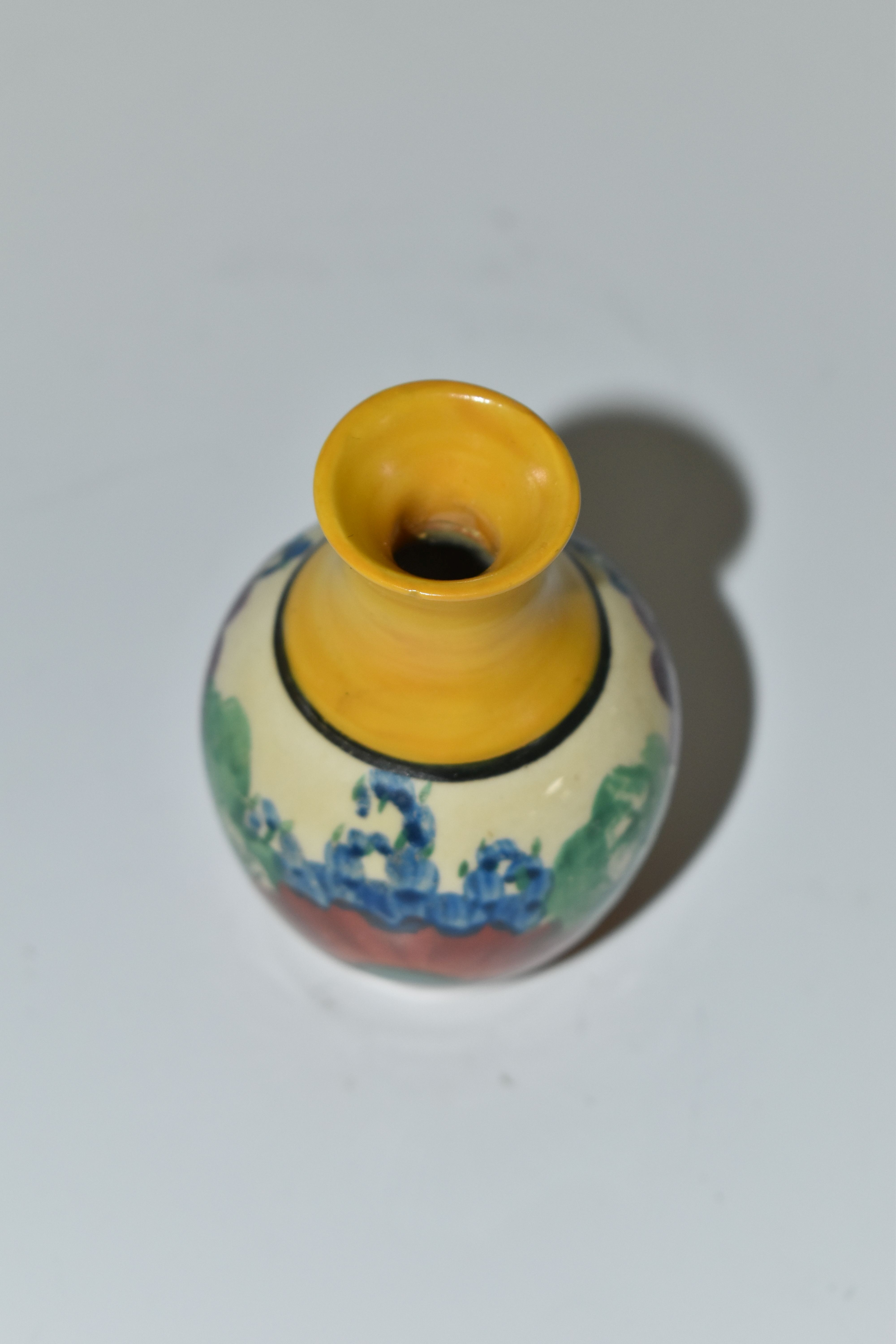A CLARICE CLIFF MINIATURE VASE, in Gayday pattern, painted with orange, red, blue and purple - Image 4 of 5