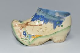 A CLARICE CLIFF SMALL SABOT/CLOG, in Taomina pattern, painted with blue stylised trees in a