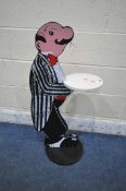 A NOVELTY PAINTED WOODEN BUTLER, height 92cm (condition report: some marks and signs of usage)
