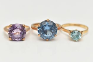 AN 18CT GOLD ZIRCON RING AND TWO GEM SET RINGS, the first set with a circular cut light blue zircon,