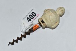 A 1920S NOVELTY CORKSCREW, the celluloid handle in the form of a 'Jolly Huntsman', height of