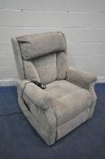 A BEIGE UPHOLSTERED RISE AND RECLINE ARMCHAIR (condition report: loose fabric to seam on the back,