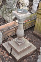 A MODERN COMPOSITE AND BRASS SUN DIAL with a two tiered square foot, baluster column and a loose