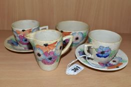 A SIX PIECE CLARICE CLIFF 'ANEMONE' PART TEA SET, comprising two teacups and saucers, a cream jug