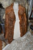 FIVE REINDEER HIDES AND TWO FUR JACKETS, the reindeer hides of similar size, length of longest 145cm