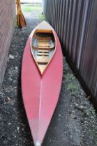 A VINTAGE 15ft WOODEN FRAMED KAYAK with vinyl covering and four double paddles